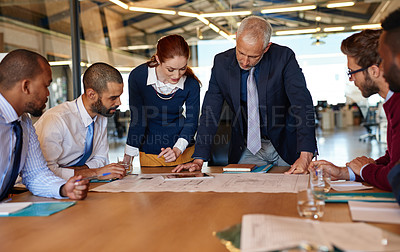 Buy stock photo Shot of a group of businesspeople working together in an office
