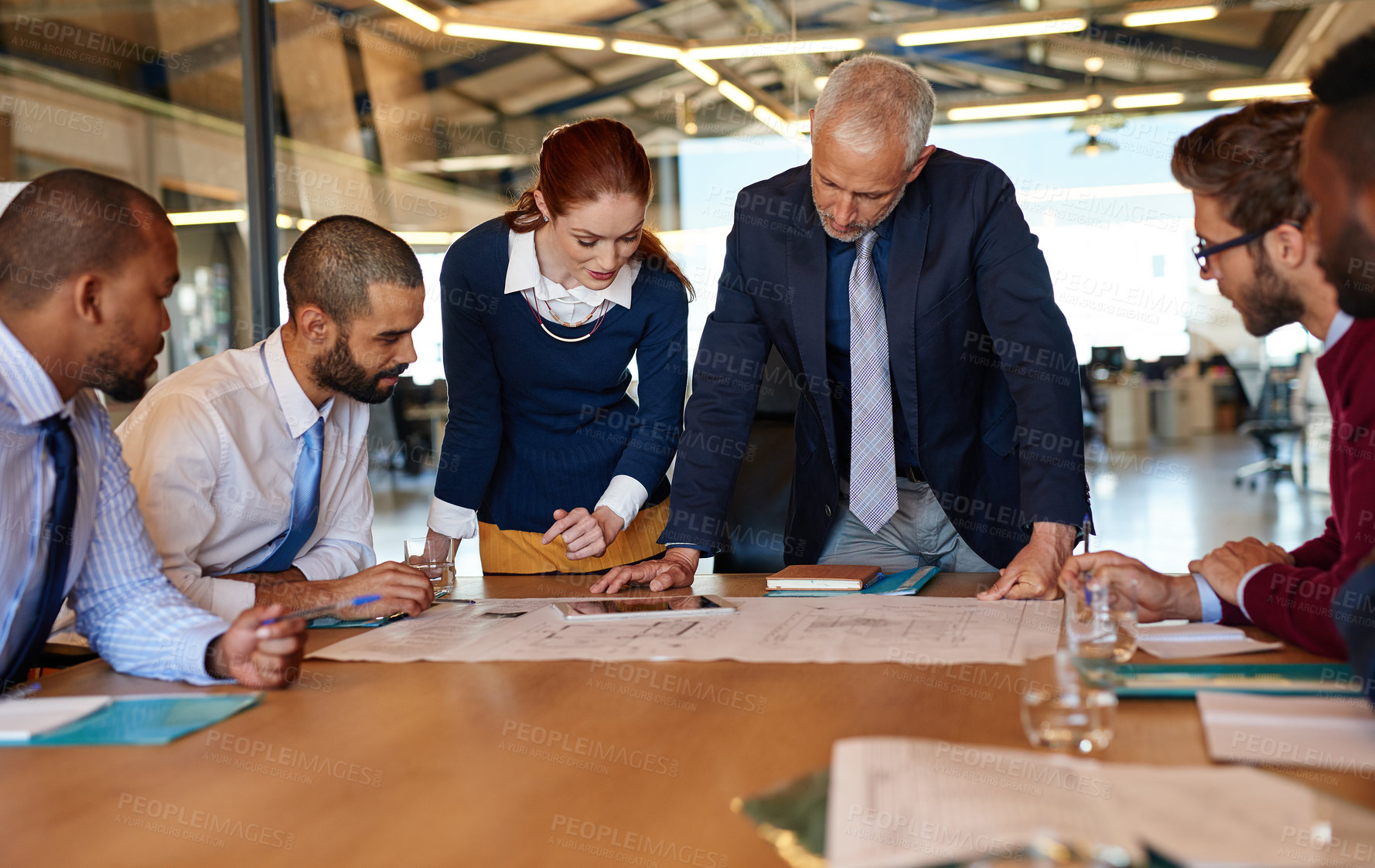 Buy stock photo Shot of a group of businesspeople working together in an office