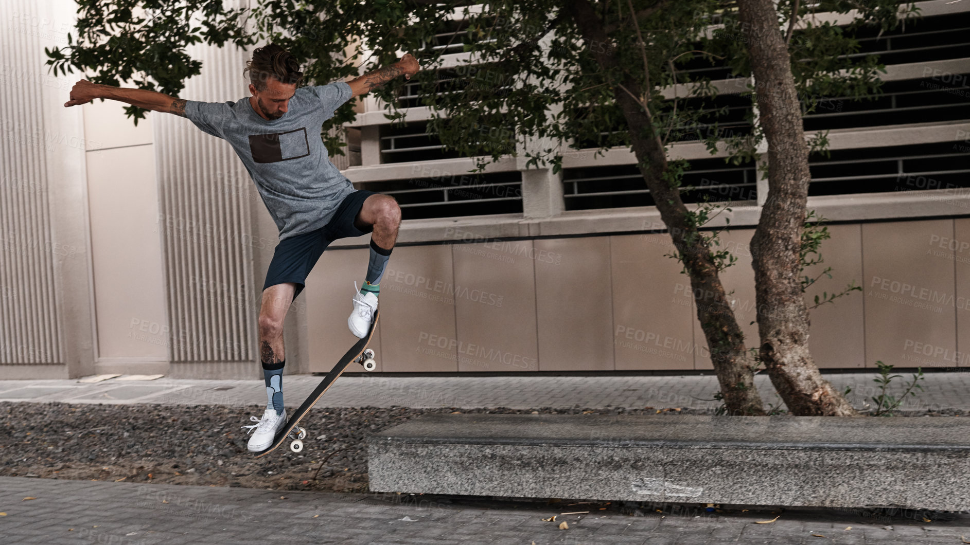 Buy stock photo Shot of skateboarders in the city