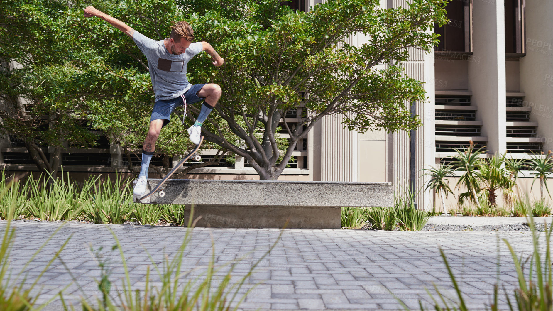 Buy stock photo Shot of skateboarders in the city