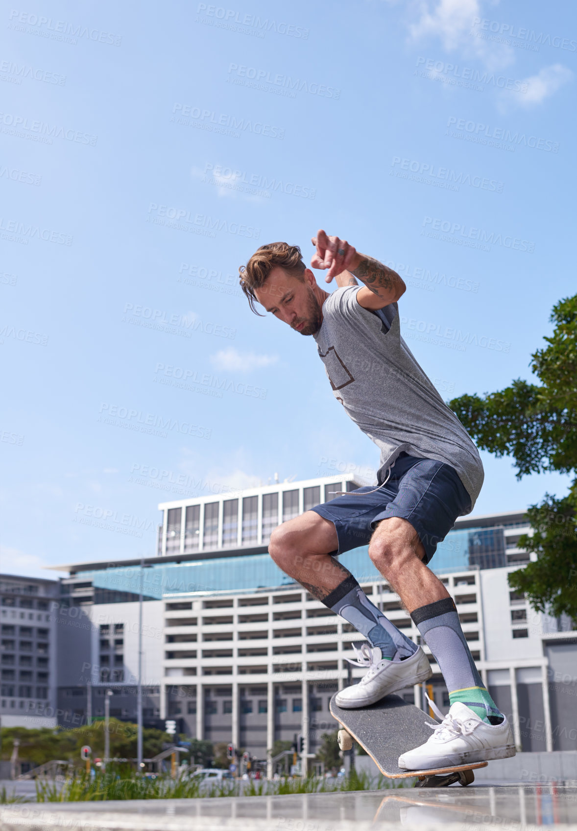 Buy stock photo Shot of skateboarders in the city