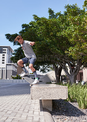 Buy stock photo Shot of skateboarders in the city