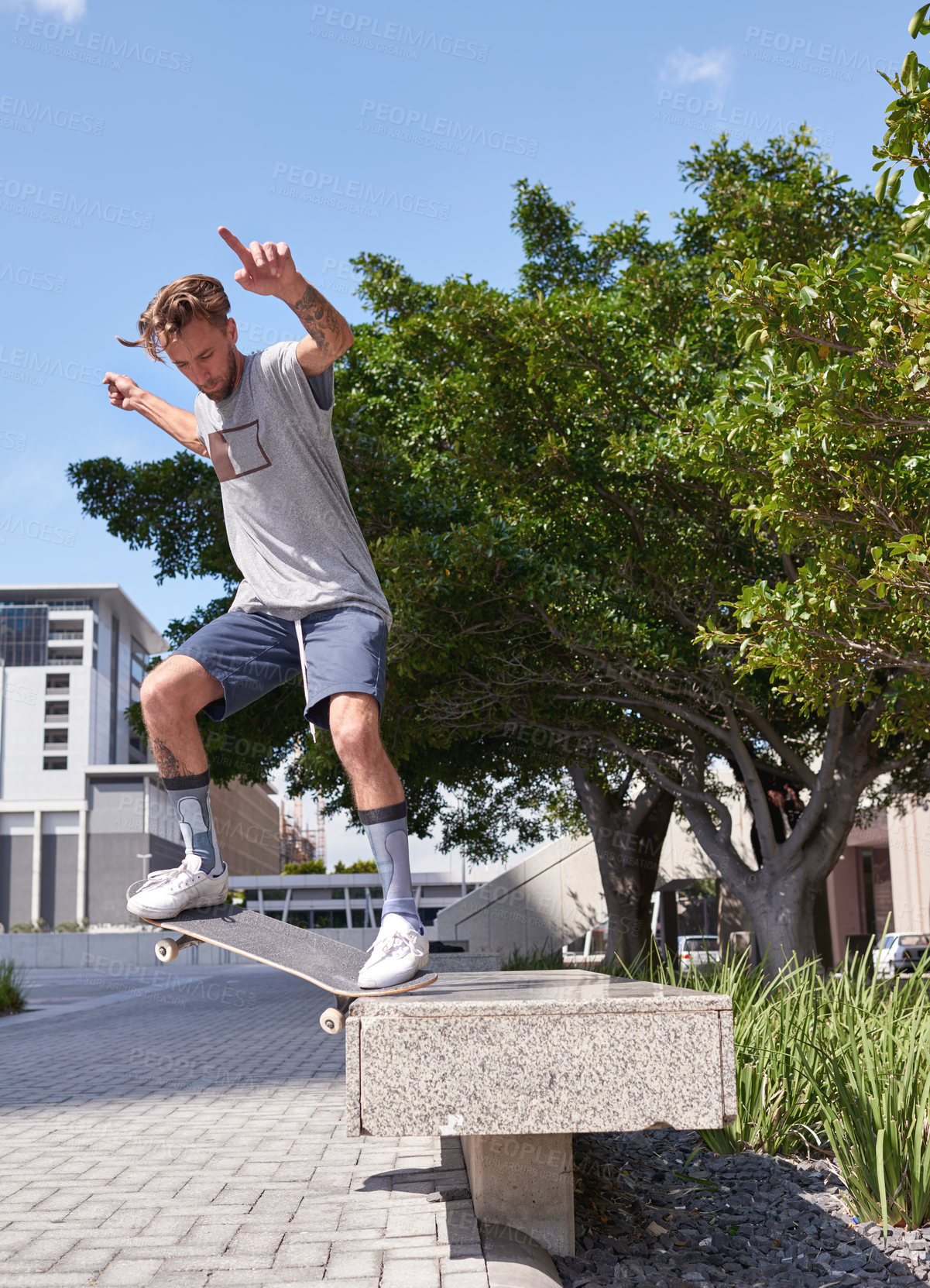 Buy stock photo Shot of skateboarders in the city