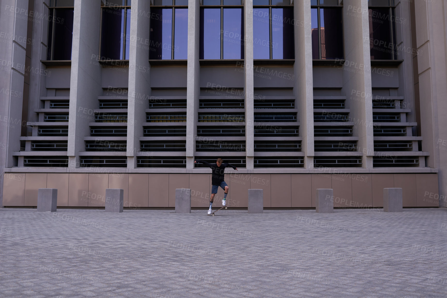 Buy stock photo Shot of skateboarders in the city