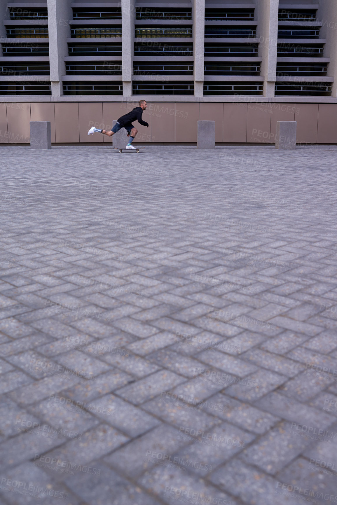 Buy stock photo Shot of skateboarders in the city