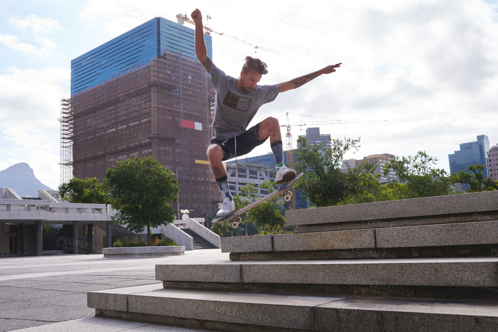 Buy stock photo Shot of skateboarders in the city