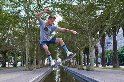 Buy stock photo Shot of skateboarders in the city