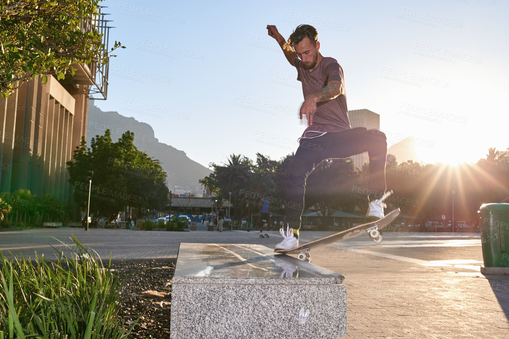 Buy stock photo Shot of skateboarders in the city