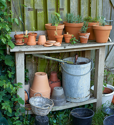 Buy stock photo Stacks of flower pots in a gardener's corner