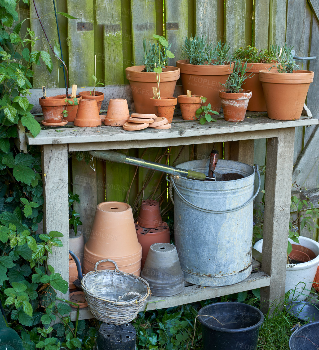 Buy stock photo Stacks of flower pots in a gardener's corner