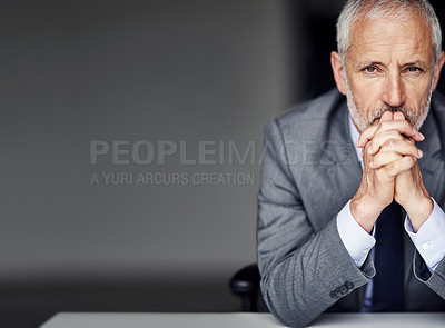 Buy stock photo Cropped portrait of a mature businessman looking pensive in his office