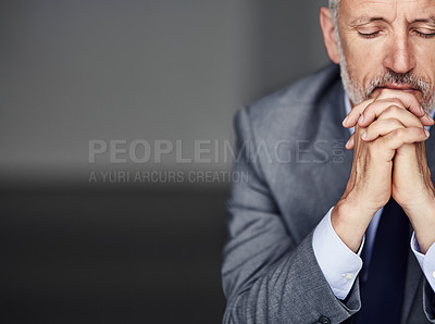 Buy stock photo Cropped shot of a mature businessman looking pensive in his office