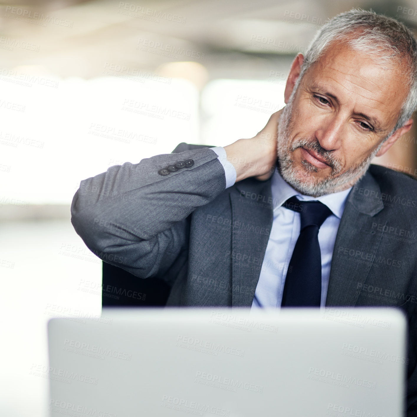 Buy stock photo Mature businessman, laptop and neck injury with pain in stress, accident or mistake at office. Man or employee with sore muscle, joint or inflammation on computer in debt or depression at workplace