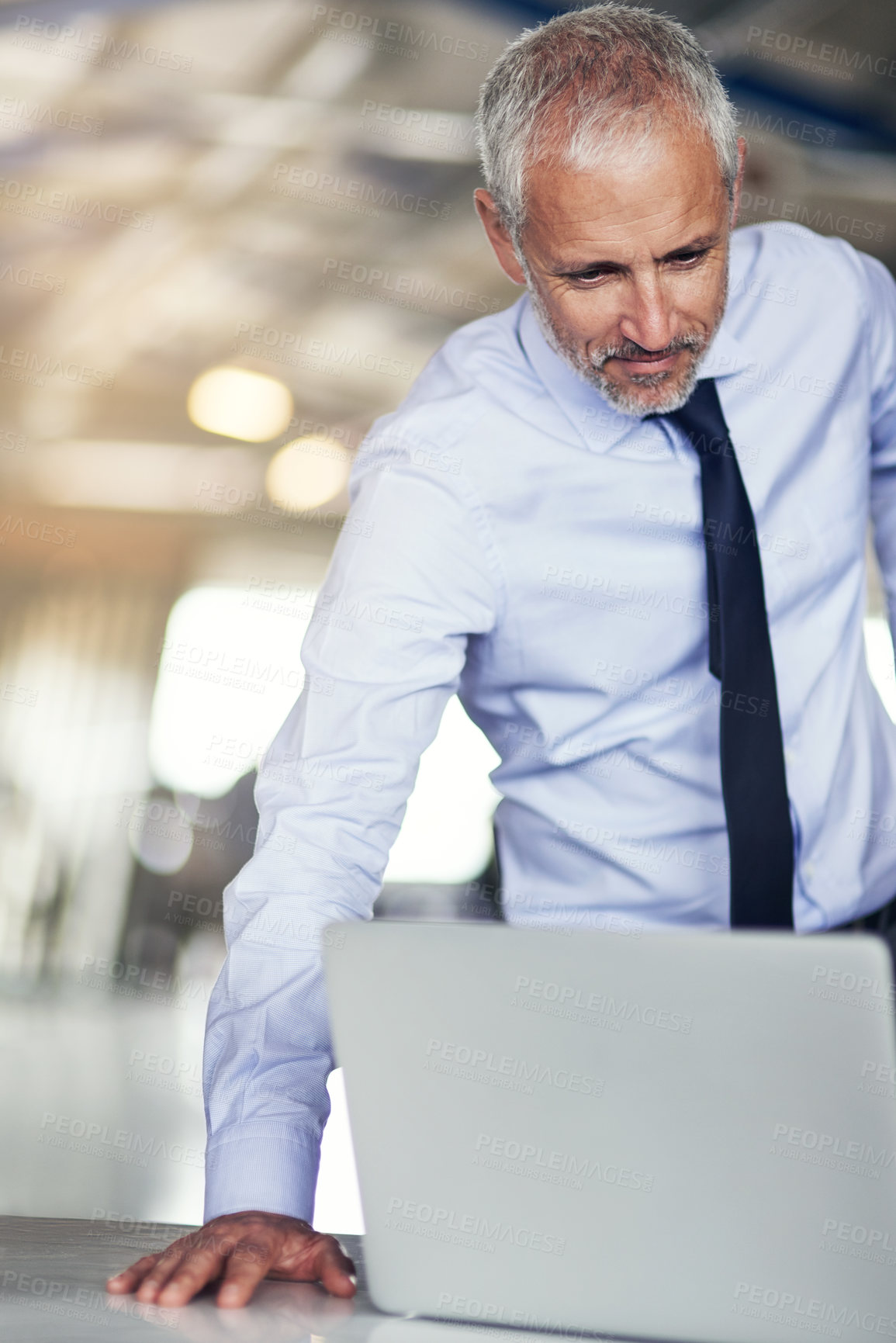 Buy stock photo Man, laptop and leaning in office with check for credit report, corporate tax at law firm for legal aid. Male advocate, workplace or computer with web assessment for company loan or building mortgage