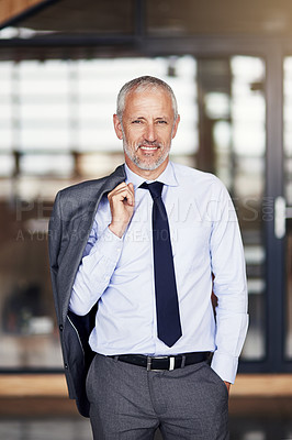 Buy stock photo Cropped portrait of a mature businessman standing with his blazer slung over his shoulder