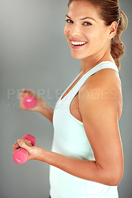 Buy stock photo Portrait, dumbbells and woman with fitness, training and exercise on grey studio background. Face, happy person and athlete with equipment, workout and smile with wellness, energy and challenge