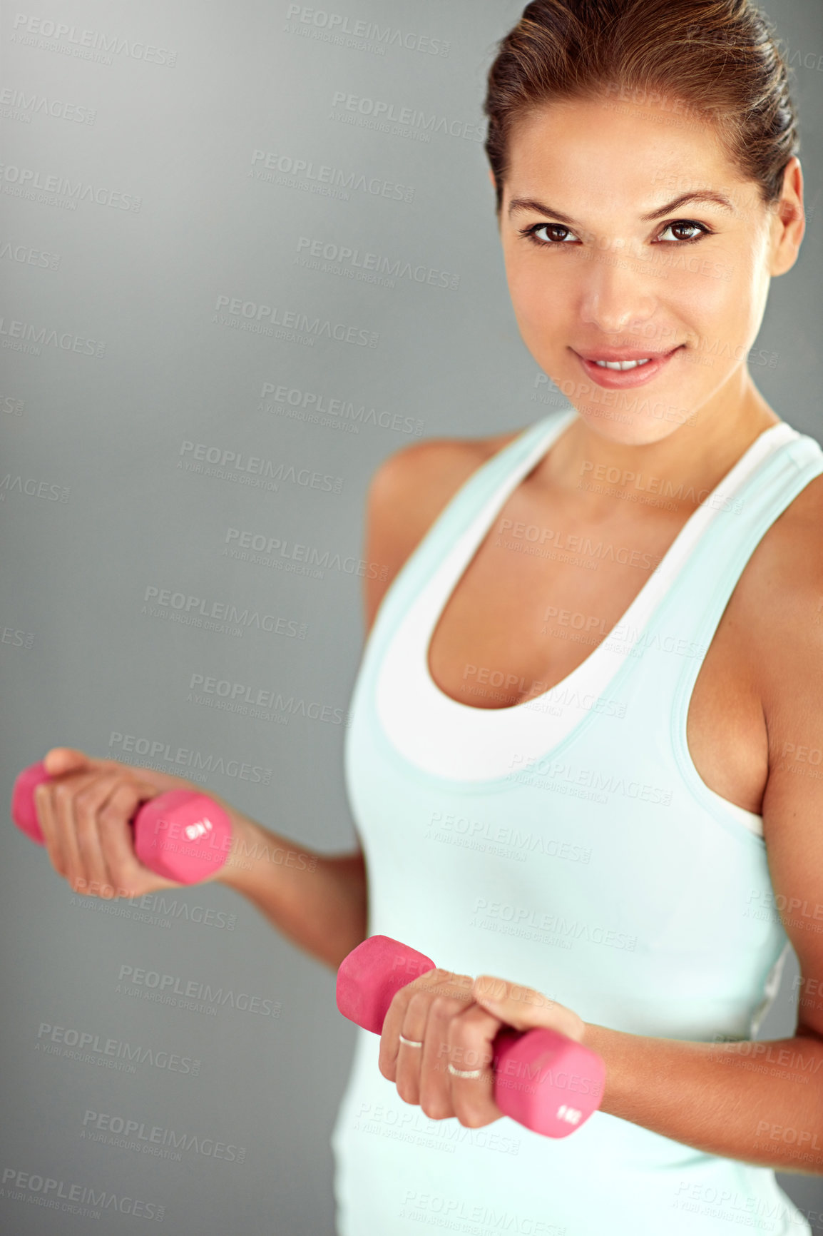 Buy stock photo Portrait, dumbbells and woman with fitness, workout and exercise on grey studio background. Face, healthy person and athlete with equipment, training and balance with wellness, energy and challenge