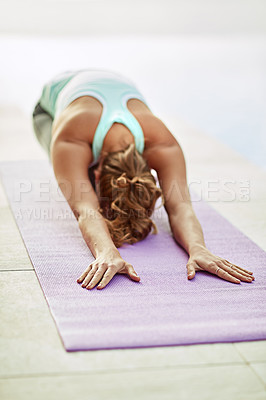 Buy stock photo Shot of a young woman doing yoga