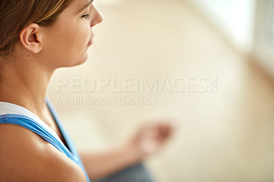 Buy stock photo Cropped shot of a woman meditating indoors