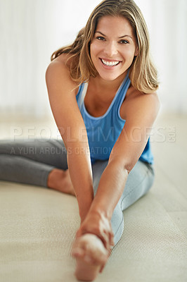 Buy stock photo Portrait of a young woman stretching her legs