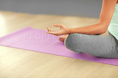 Buy stock photo Cropped shot of a woman meditating indoors