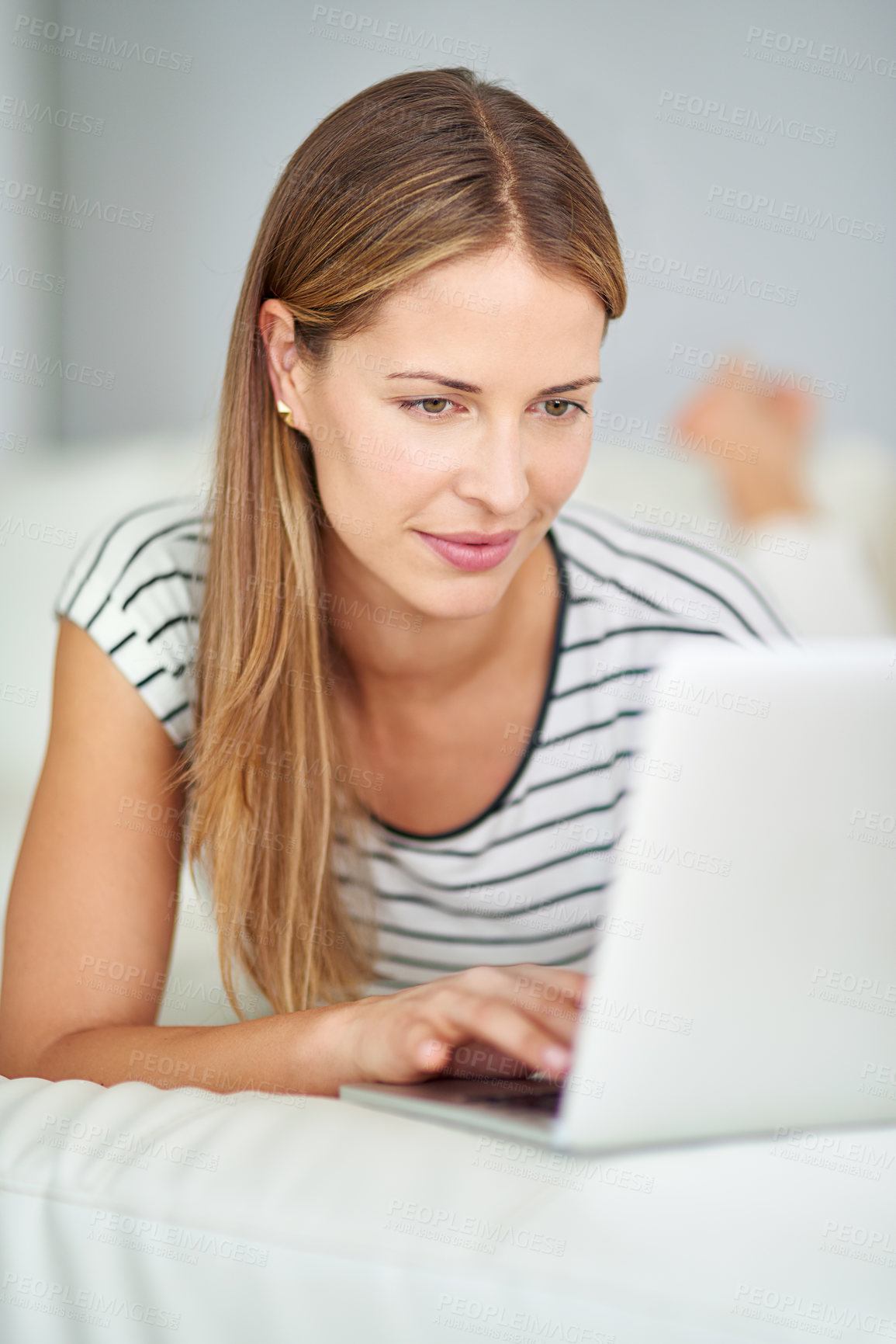 Buy stock photo Woman, laptop and internet browsing in home for streaming movies, watching online video and web blog update. Female person, computer and post for social media, reading ebook and series subscription