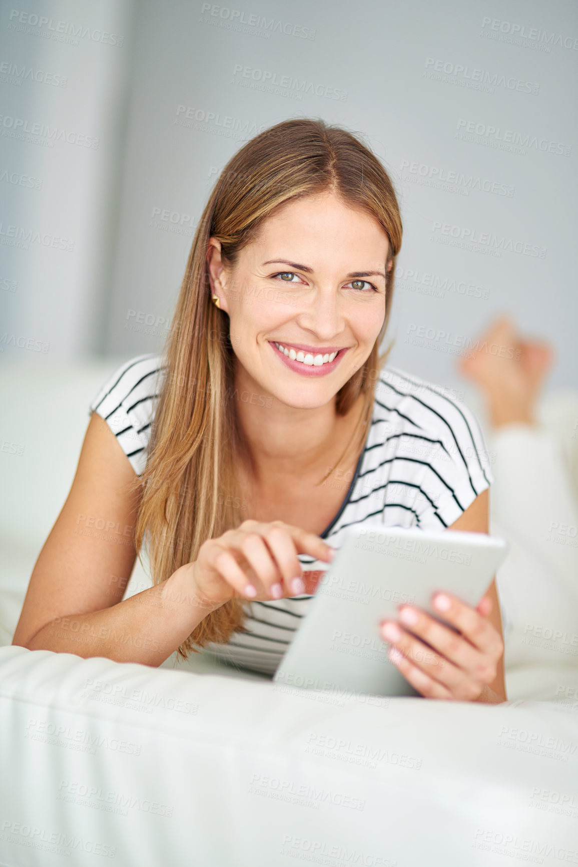 Buy stock photo Woman, portrait smile and tablet for browsing with streaming film, playing online crossword and blog update in home. Happy lady, tech and post for social media, reading ebook and download game app