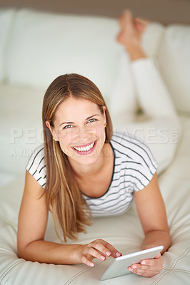 Buy stock photo Shot of a young woman browsing the internet at home
