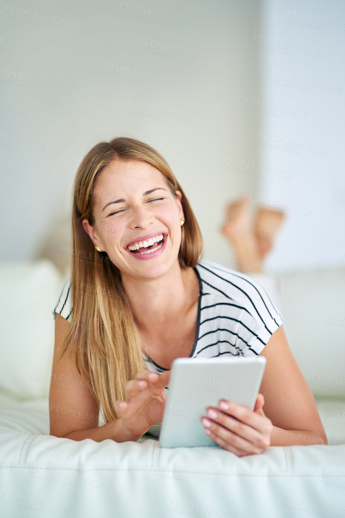 Buy stock photo Woman, tablet connection and laughing in home for streaming comedy film, funny gif and blog update. Happy lady, digital tech and humor for social media meme, online skit and reading crazy story