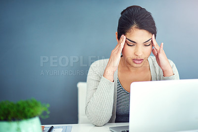 Buy stock photo Shot of a businesswoman sitting with her hands on her head