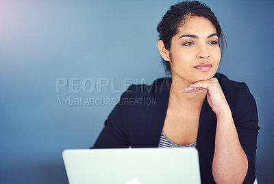 Buy stock photo Cropped shot of a young businesswoman looking distracted at her desk
