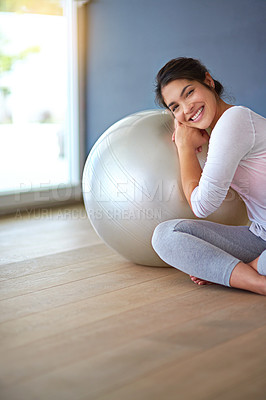 Buy stock photo Health, happy woman and yoga ball in portrait on floor for core workout, balance and weight loss in home studio. Yogi, smile and exercise equipment for fitness, wellness and morning routine in house