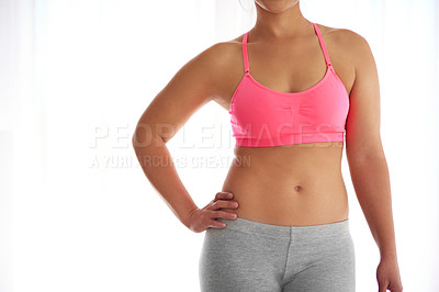 Buy stock photo Hands, stomach and fitness for woman in studio by mock up space to lose weight by white background. Person, model and abdomen with sportswear for training, exercise or workout for body transformation