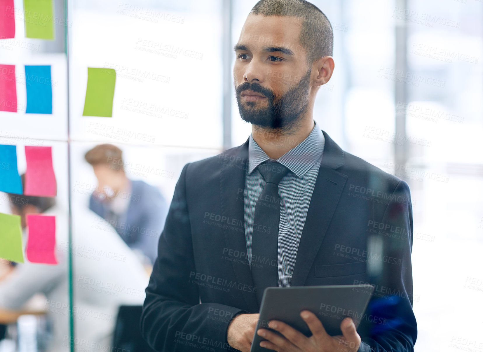 Buy stock photo Cropped shot of a young businessman working at the idea board