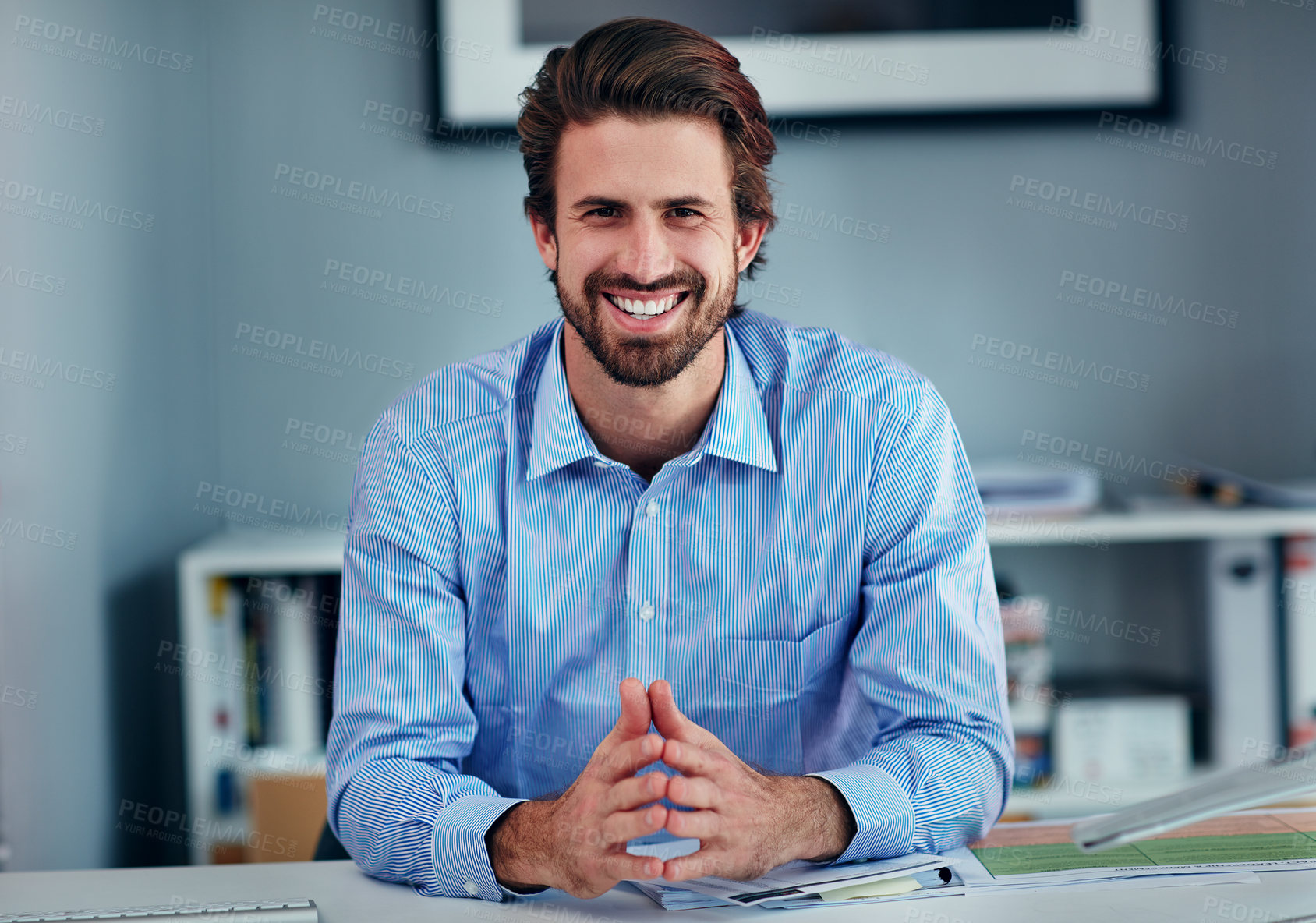 Buy stock photo Portrait, smile and man in office, desk and happy in public relations, documents and confident for business. Corporate, employee and person in media agency, publicist and proud for planning of launch