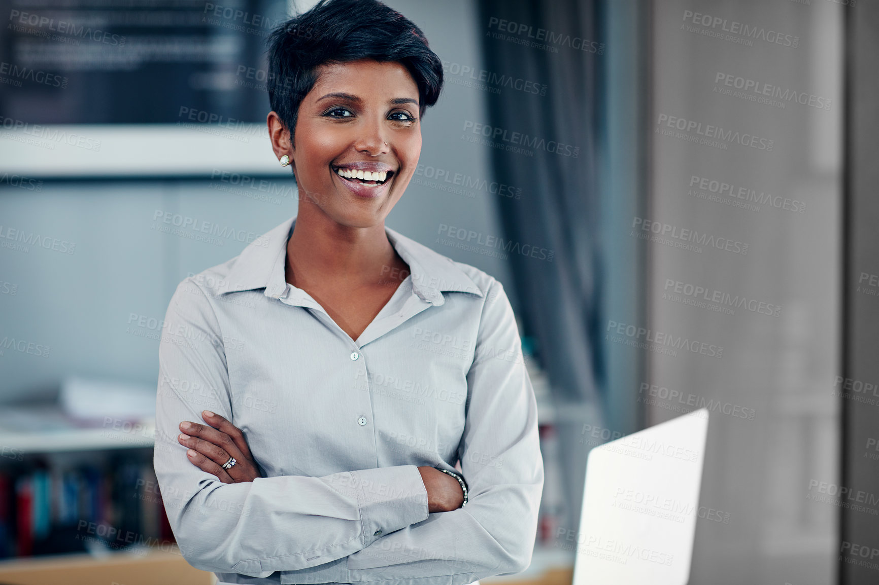 Buy stock photo Portrait of a young businesswoman standing in her office