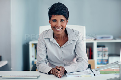 Buy stock photo Portrait of a young businesswoman sitting at her desk in an office