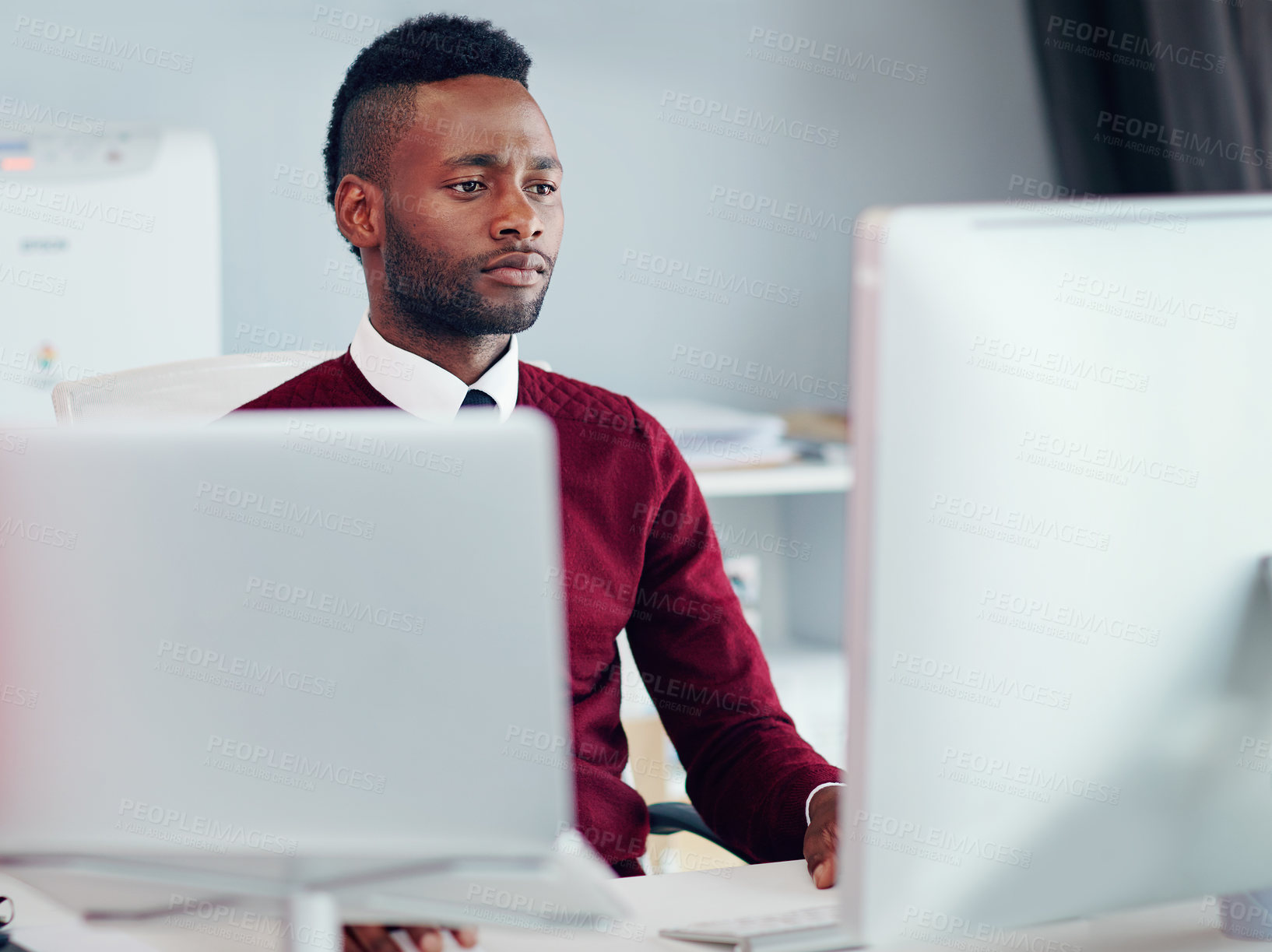 Buy stock photo Shot of a businessman working at his desk