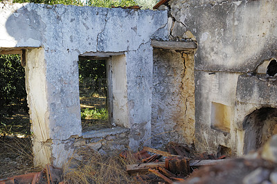 Buy stock photo Historic building ruins with dirt and grass growing. Old ancient house or home broken and damaged. Open window in thick stone vintage design or architecture. Weathered antique farmhouse or building