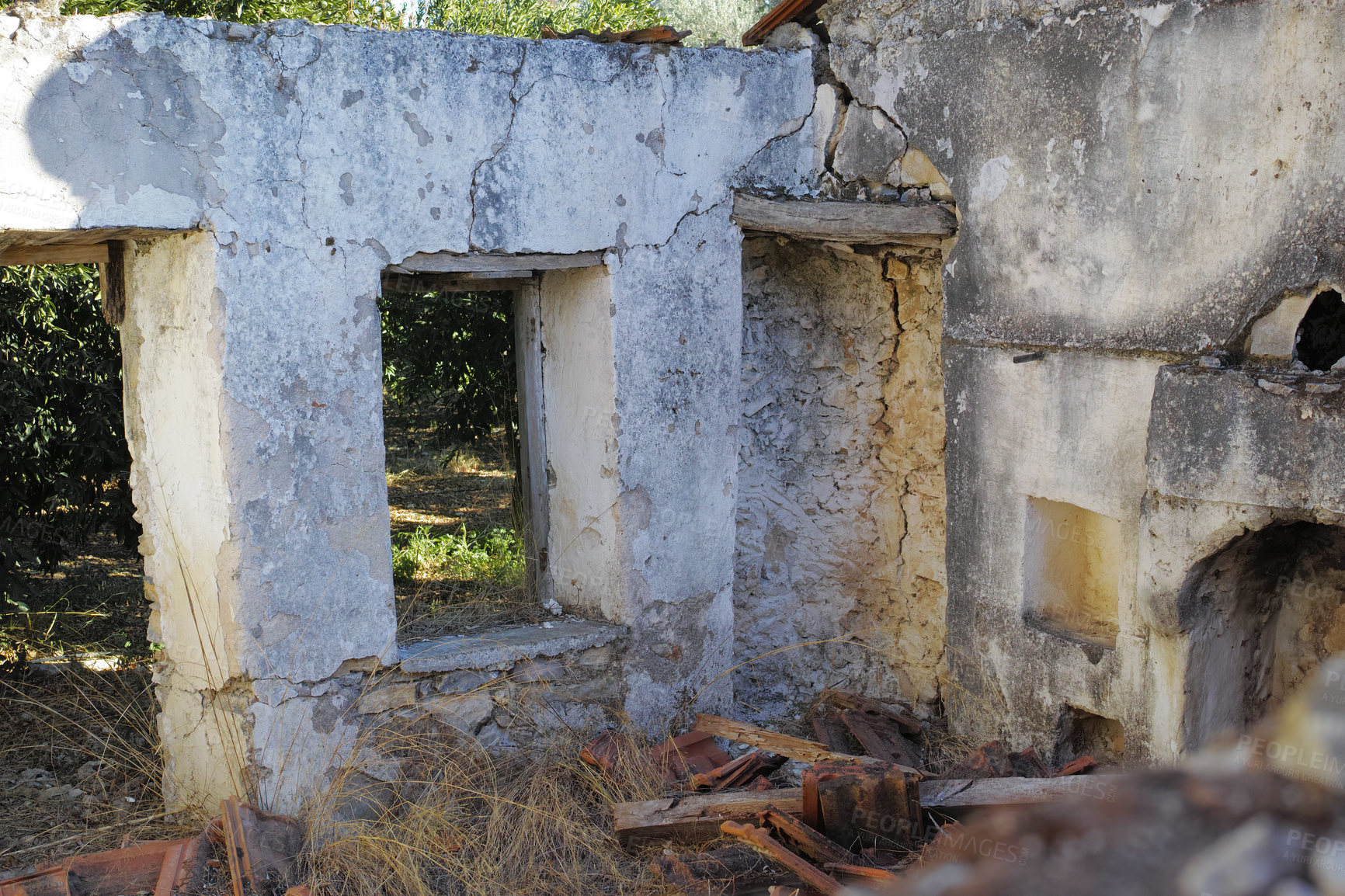 Buy stock photo Historic building ruins with dirt and grass growing. Old ancient house or home broken and damaged. Open window in thick stone vintage design or architecture. Weathered antique farmhouse or building