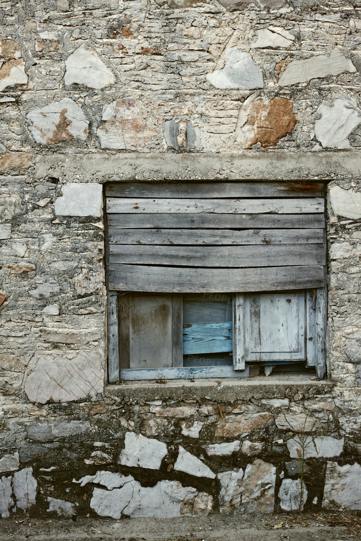 Buy stock photo Wooden window boarded on an old rough stone wall farmhouse or ancient house. Vintage, rustic, old fashioned frame and shutters on historic village building. Antique architecture structure background