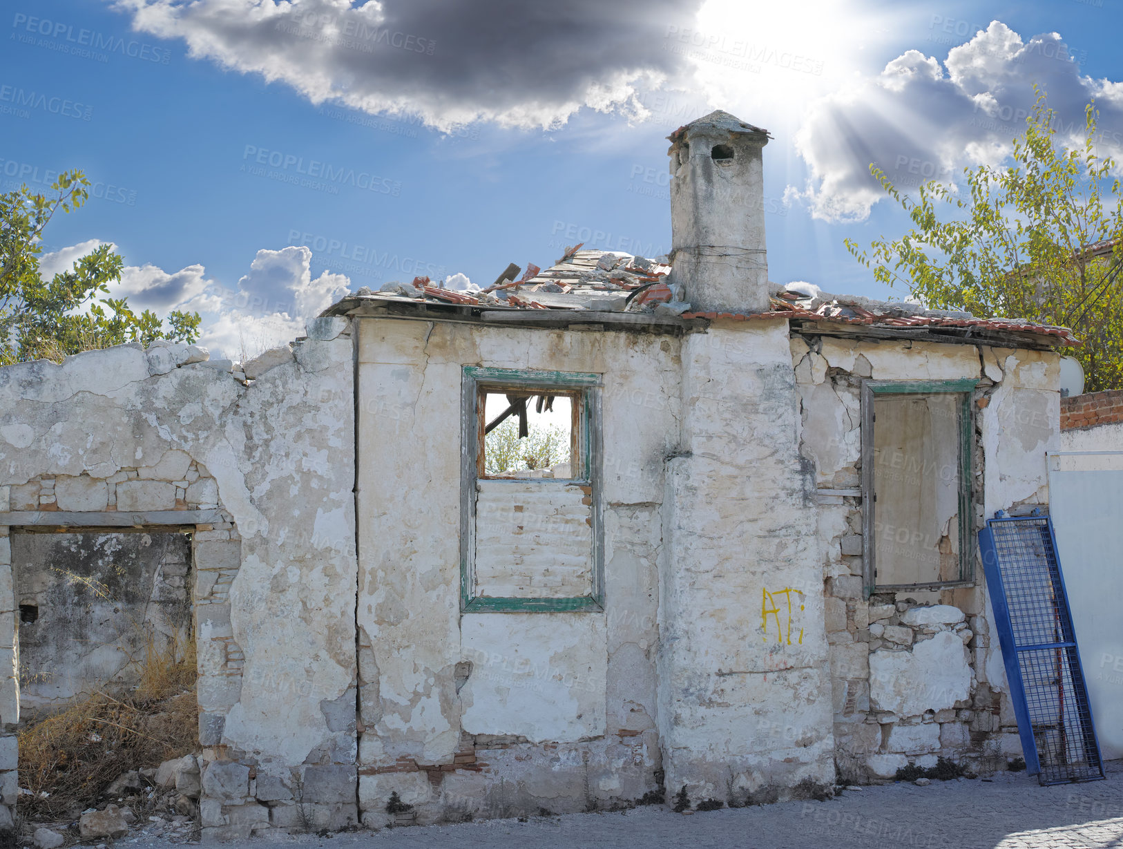 Buy stock photo A broken old house abandoned from poverty, unemployment on city outskirts. Empty rustic dilapidated home in ruins from economic crash, financial crisis. Exterior of destructed, neglected residence  