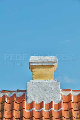 Buy stock photo Brick chimney designed on slate roof of house building outside against blue sky background. Construction of exterior architecture of escape chute built on rooftop for fireplace smoke and heat