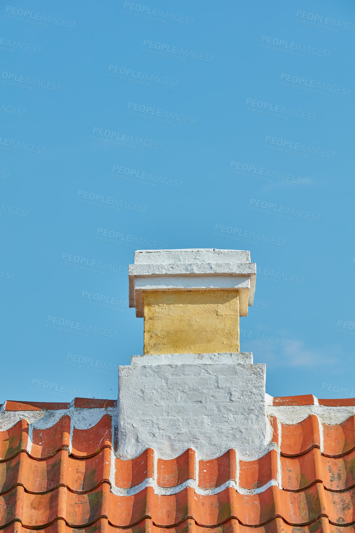 Buy stock photo Brick chimney designed on slate roof of house building outside against blue sky background. Construction of exterior architecture of escape chute built on rooftop for fireplace smoke and heat