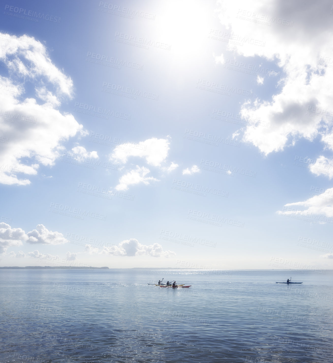 Buy stock photo An early morning photo of young people kayaking on the ocean