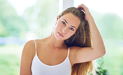Buy stock photo Cropped portrait of a young woman posing in a tank top