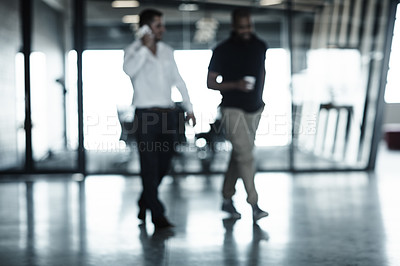Buy stock photo Full length shot of two businessmen walking through an office