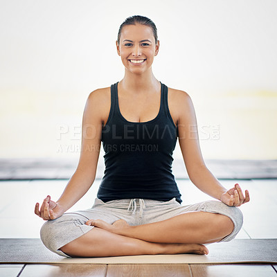 Buy stock photo Full length portrait of a young woman meditating