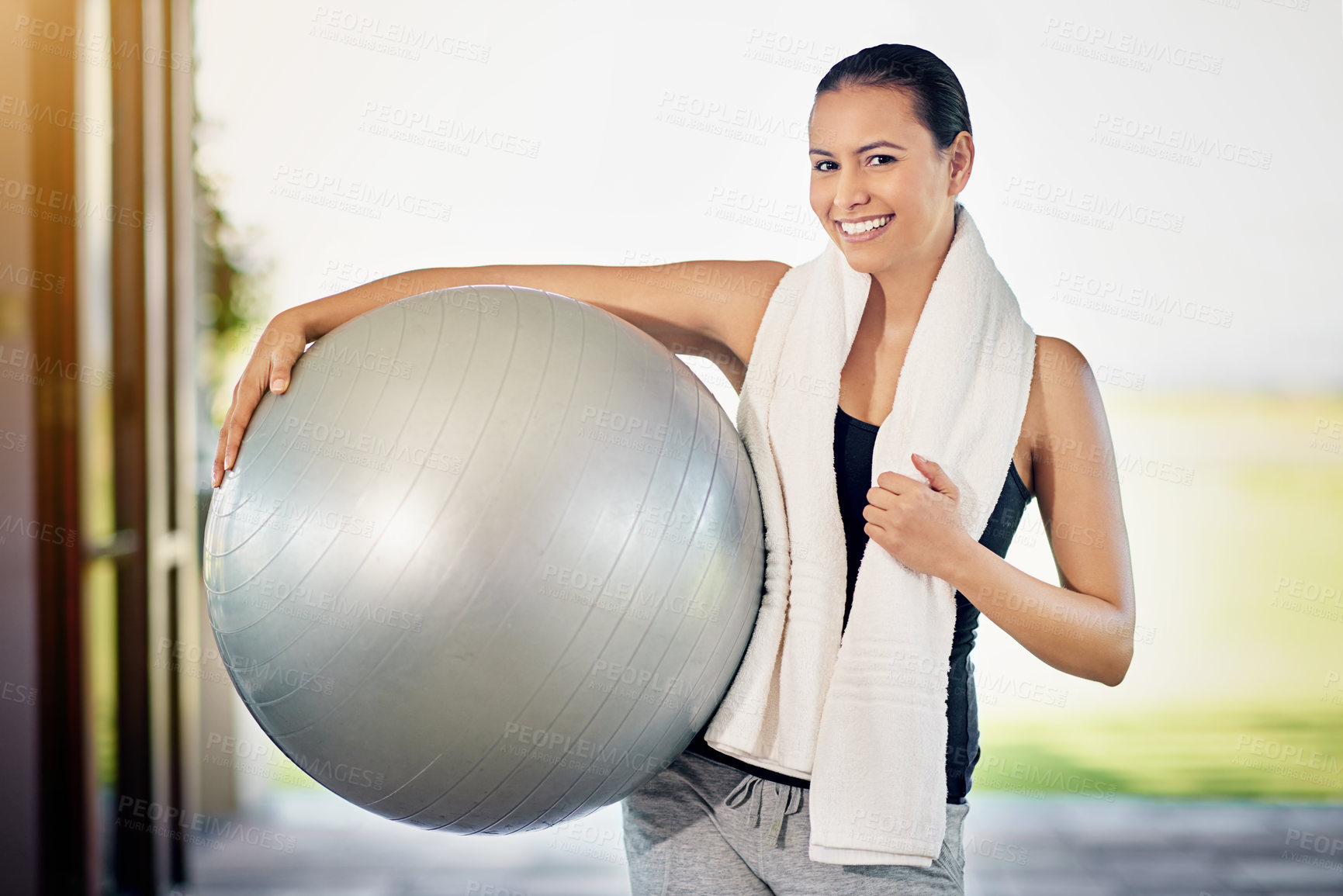 Buy stock photo Cropped portrait of a young woman carrying her exercise ball