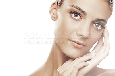Buy stock photo Studio portrait of a beautiful young woman touching her face isolated on white